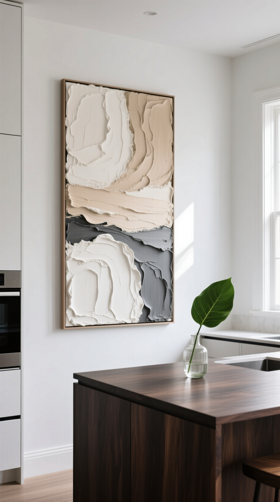 11 Diy Kitchen Wall Decor Ideas That Look High End 7 A large DIY textured abstract canvas painting in neutral tones hangs on a white wall in a modern kitchen as a focal point.