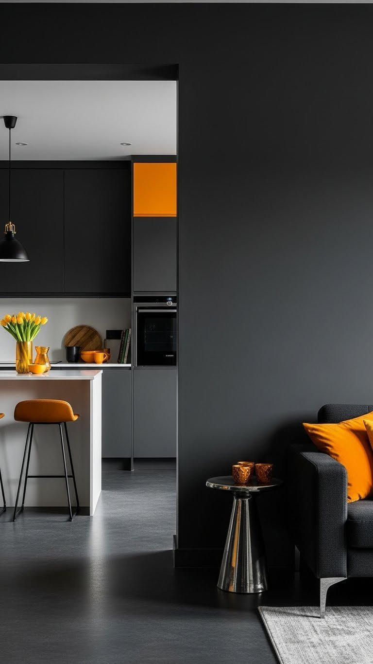 Sophisticated kitchen living. Dark gray, vibrant orange accents, white island, metallic. Bold design.
